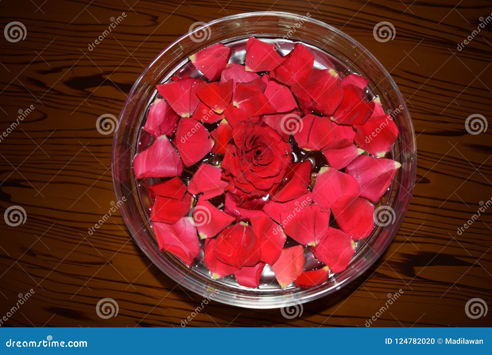 red rosepetals in water filled bowl