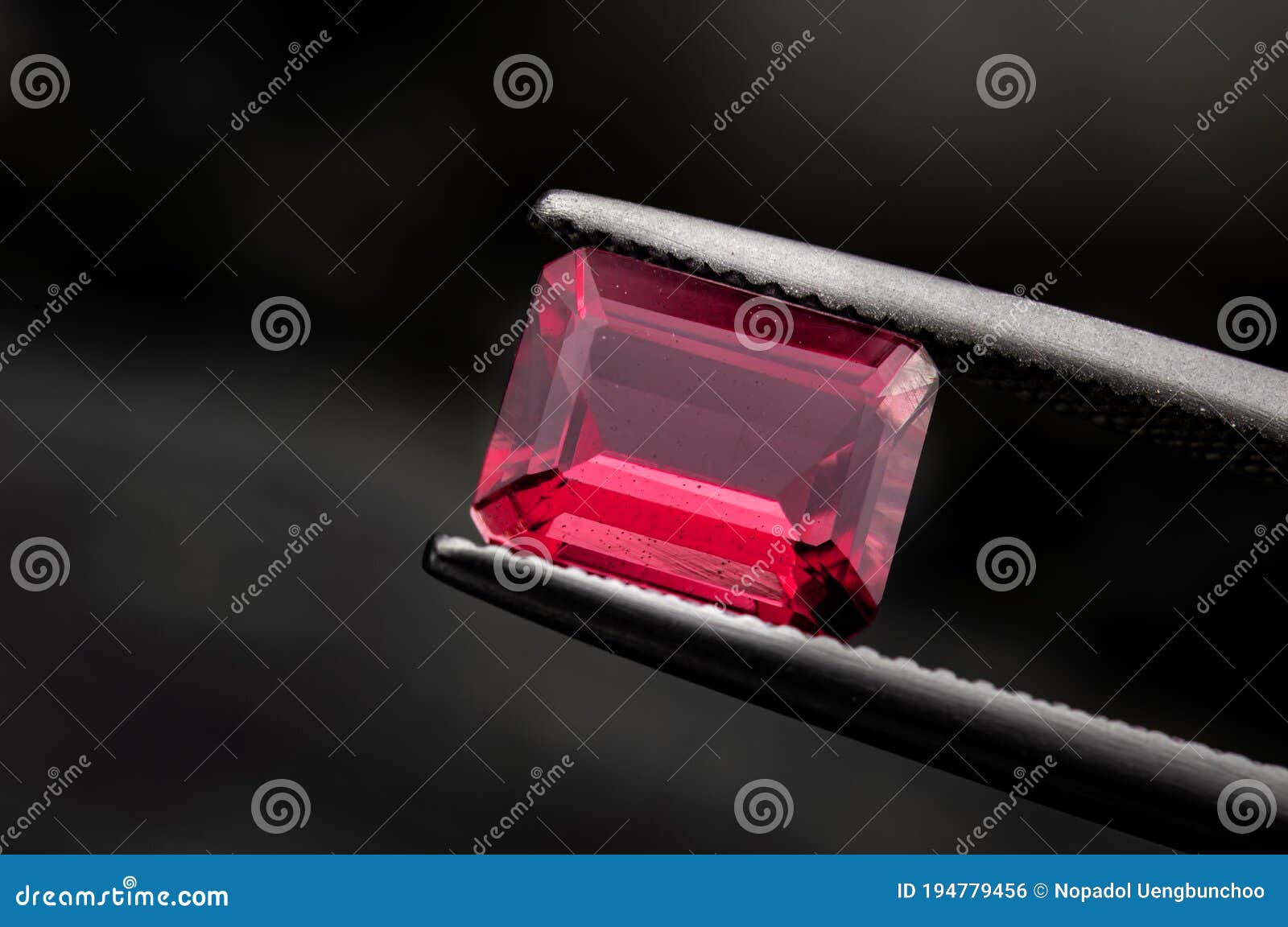 red ruby gemstone with dark rock