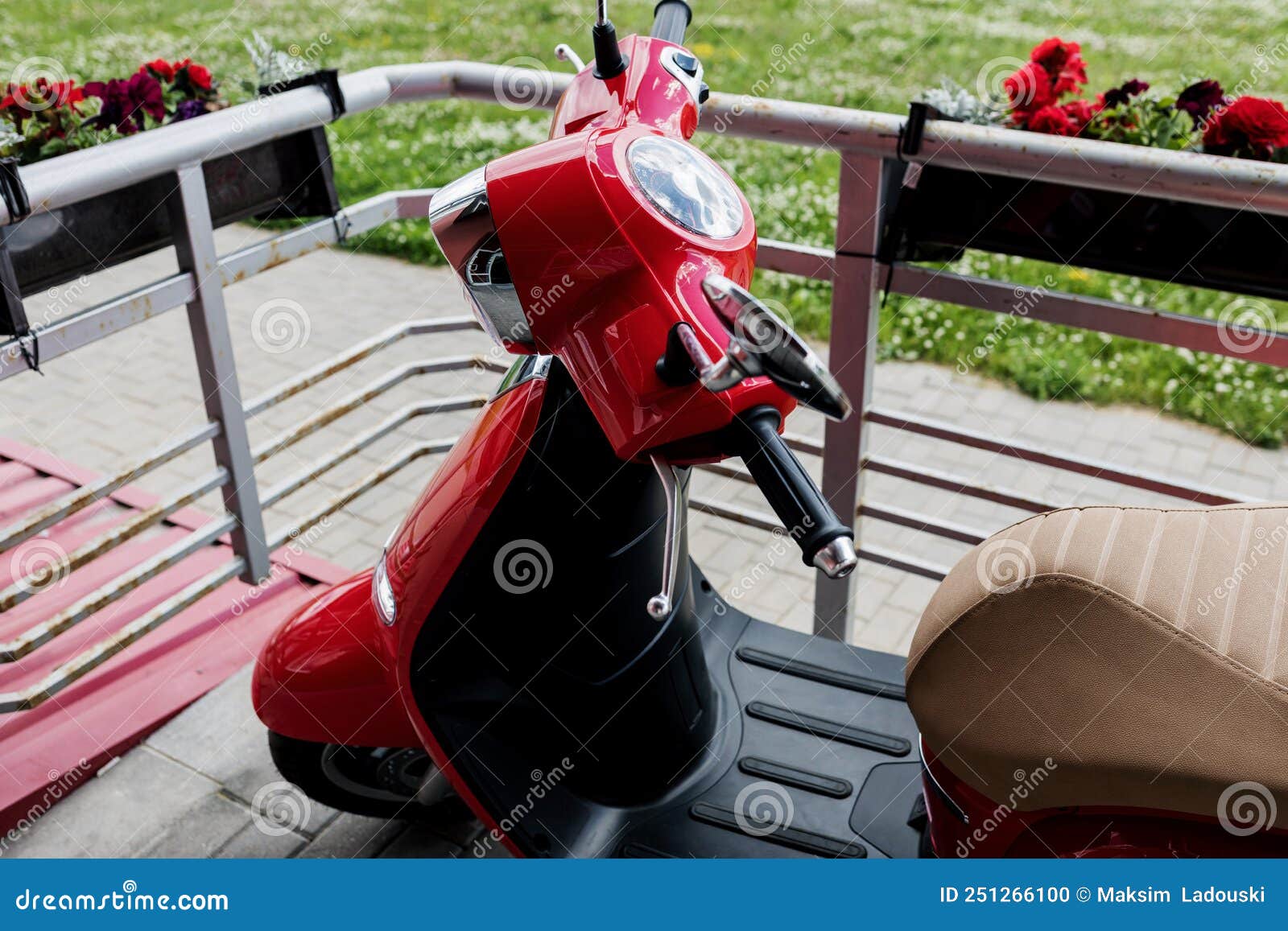 Red scooter in street editorial image. Image of motor 251266100