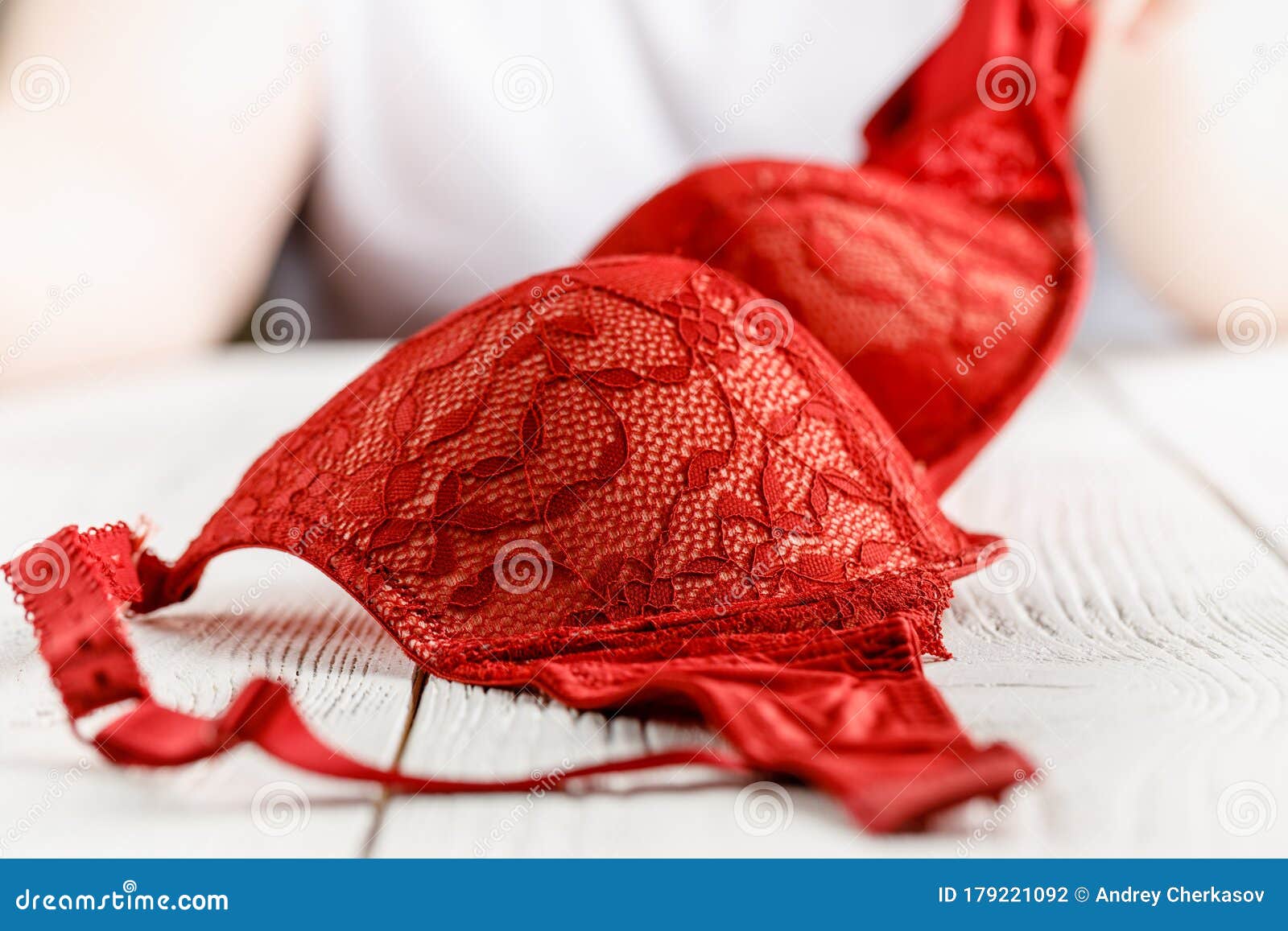Red lace bra in hands stock photo. Image of information 179221092
