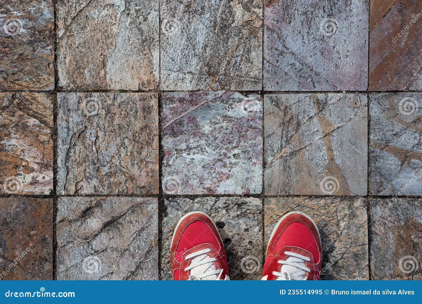 red shoes on a beautiful stone floor grid of squares, arquitecture background.