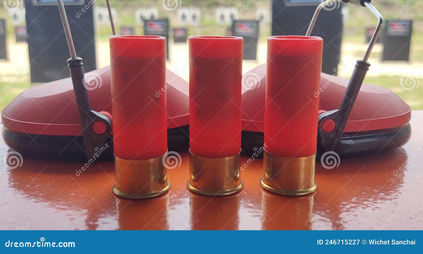 Red 3shot Shotgun and Noisereducing Ear Muffs. Stock Image Image of