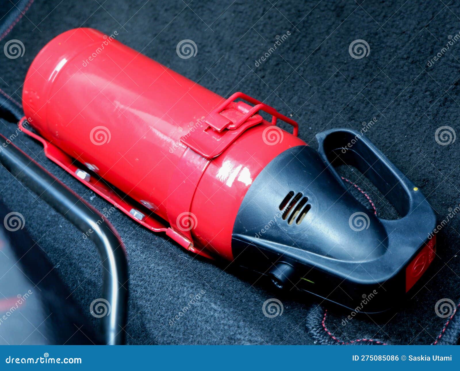 Red Small Fire Extinguisher in the Car for Safety and Prevent Fire