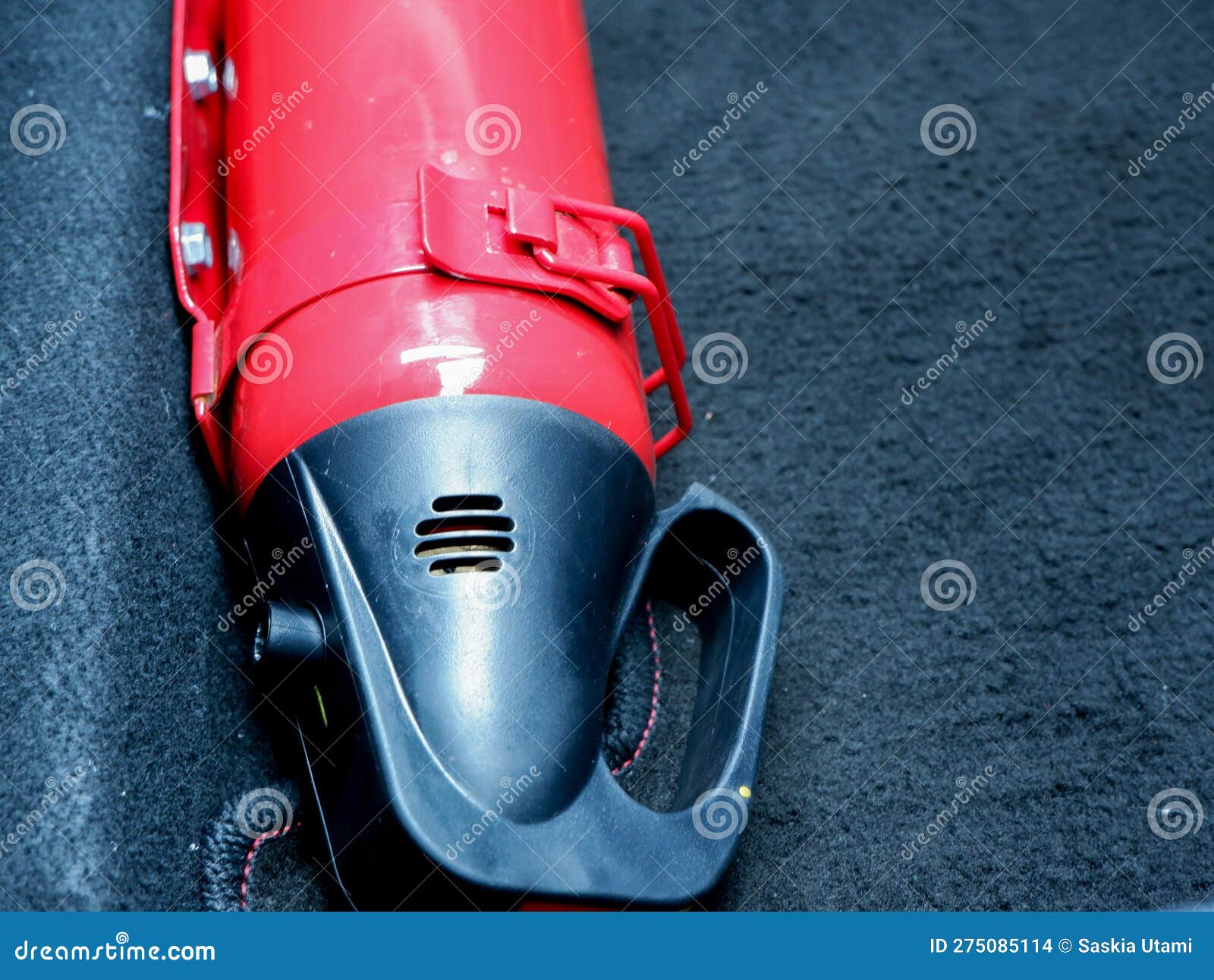 Red Small Fire Extinguisher in the Car for Safety and Prevent Fire