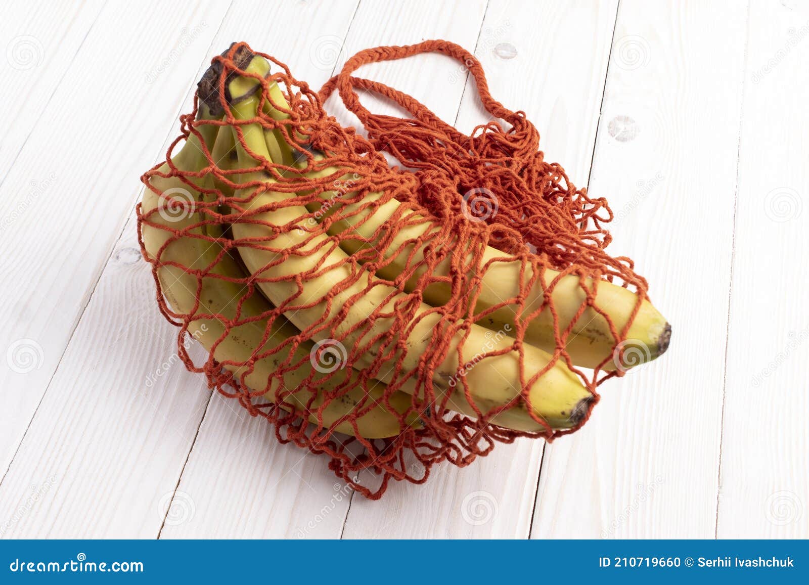 Red String Shopping Bag with Bananas. Stock Photo Image of waste