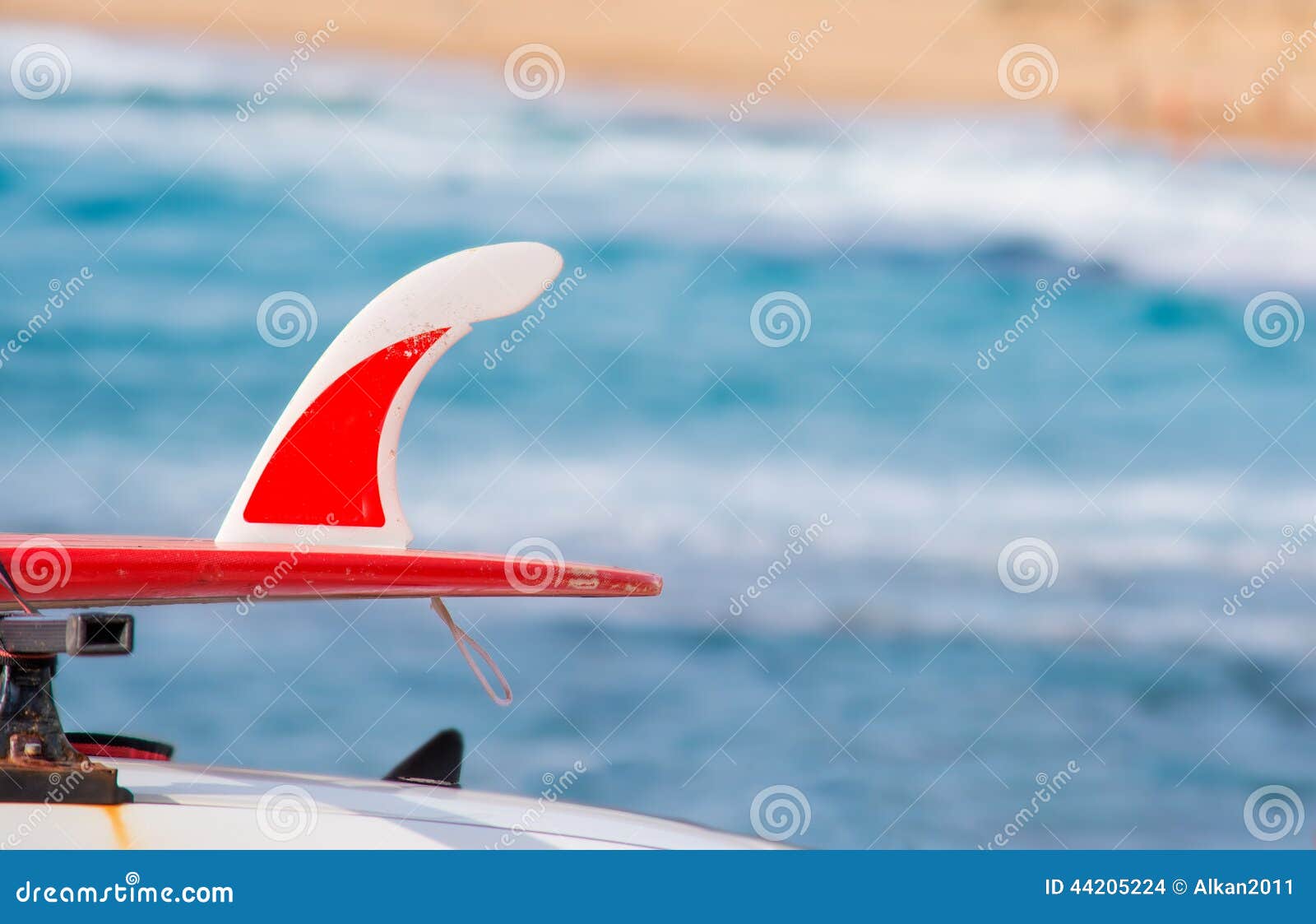 Red surfboard on a car stock photo. Image of green, water 44205224