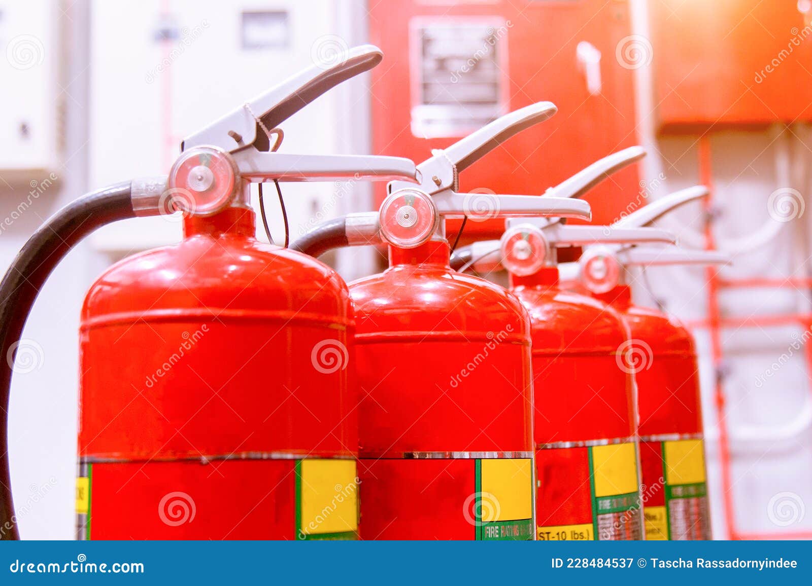 Red Tank of Fire Extinguisher Overview of a Powerful Industrial Fire
