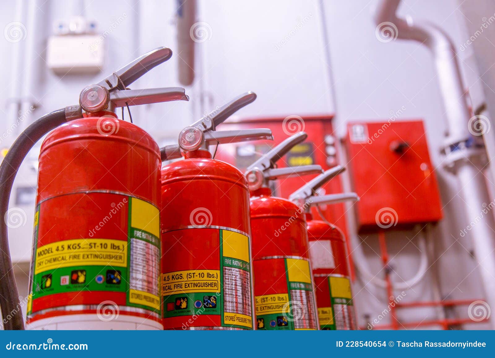 Red Tank of Fire Extinguisher Overview of a Powerful Industrial Fire