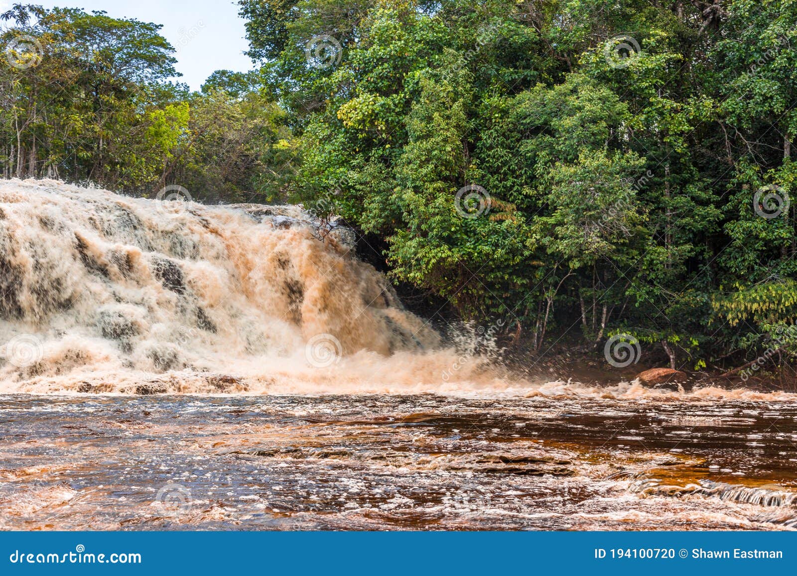waterfall cascading into the amazon river at presidente figueiredo in brazil, south america