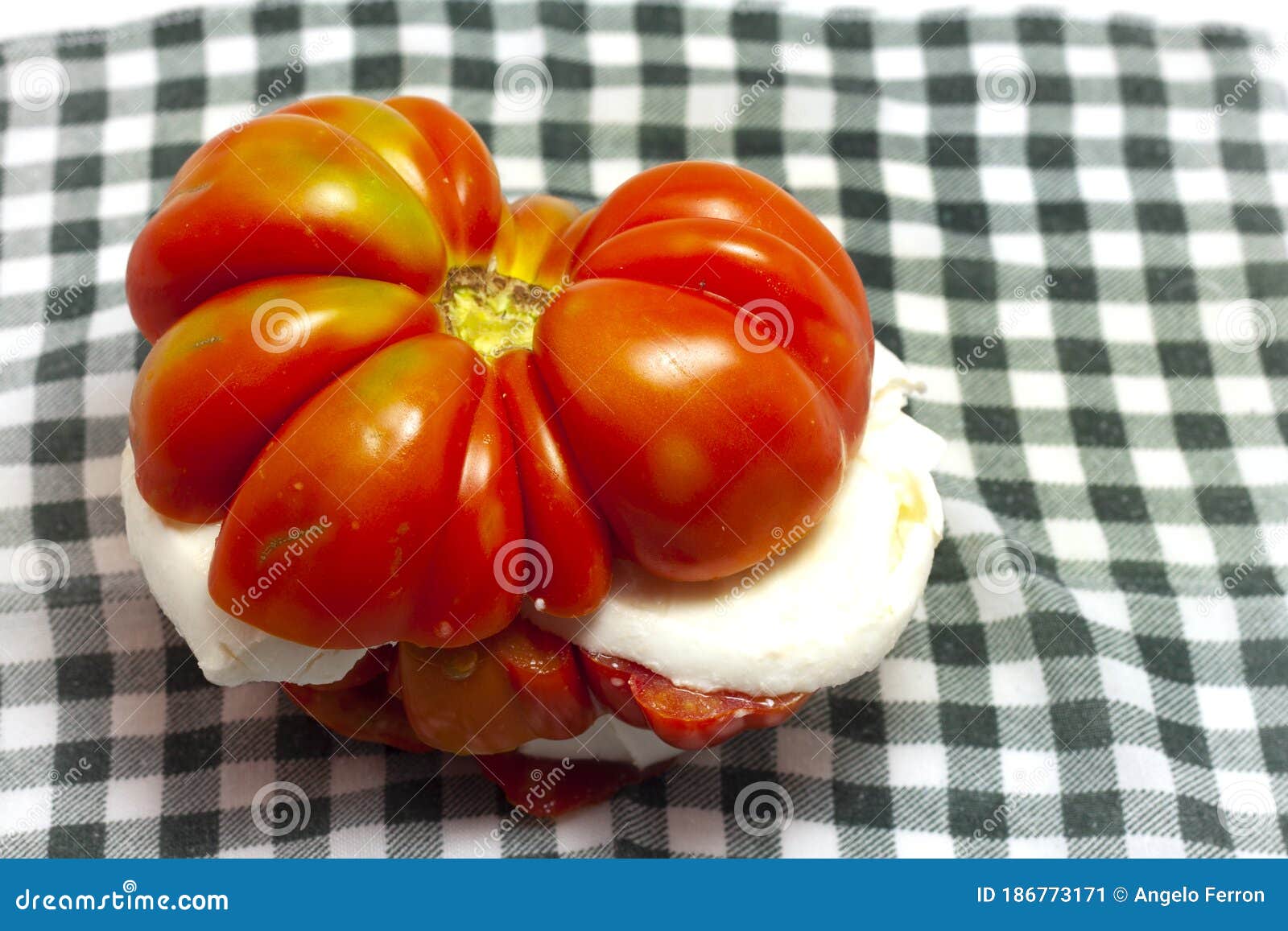 red tomato from salad cut with mozzarella