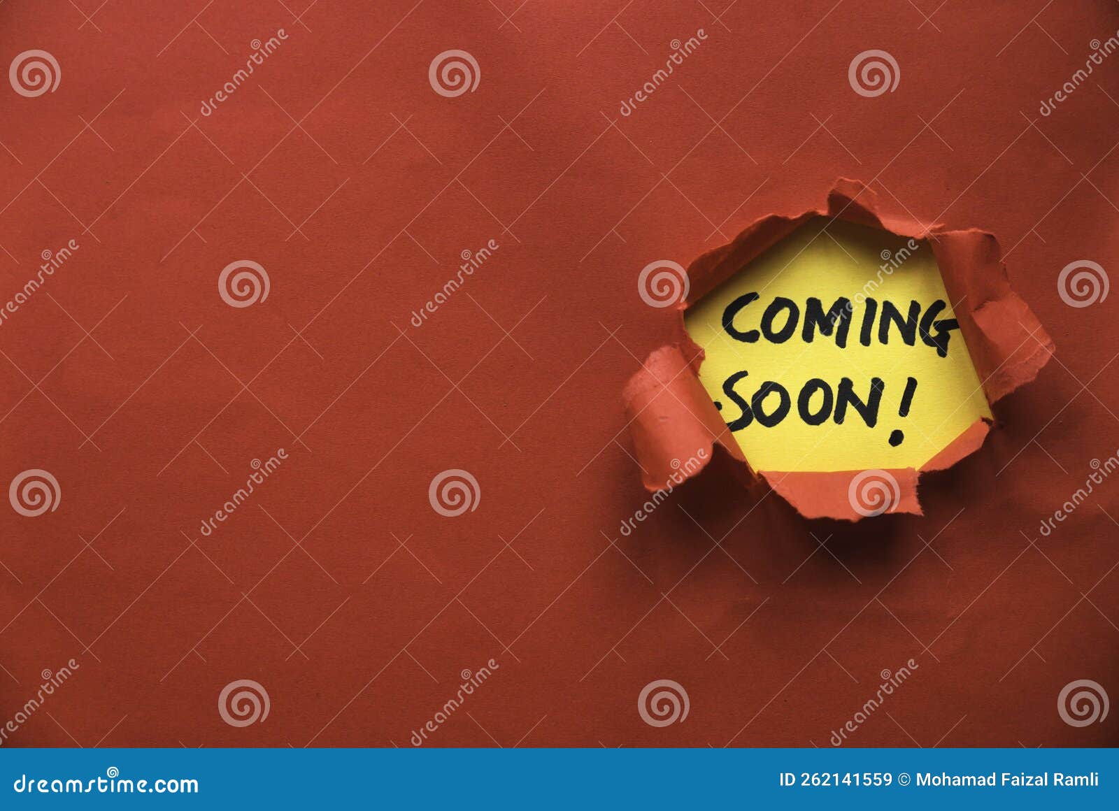 Red Torn Paper with a Yellow Paper Written with Coming Soon. Copy Space