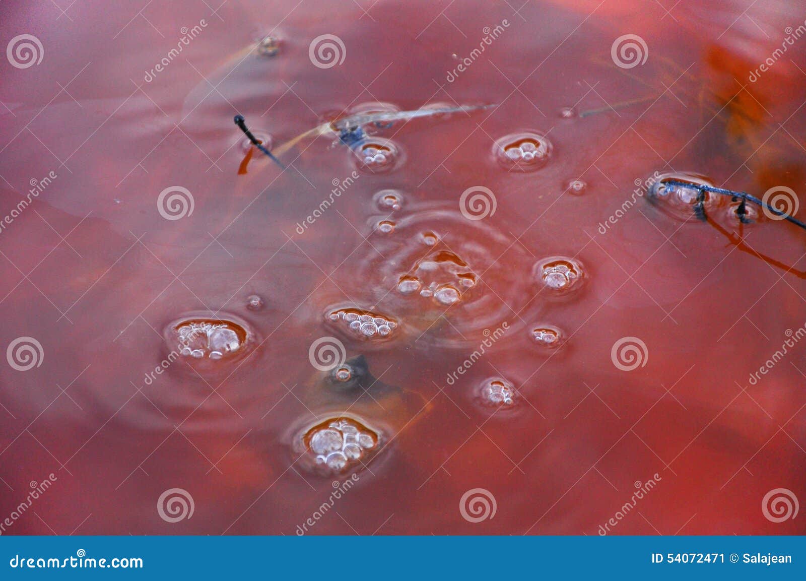 red toxic contaminated water from a copper mine in geamana, rosia montana