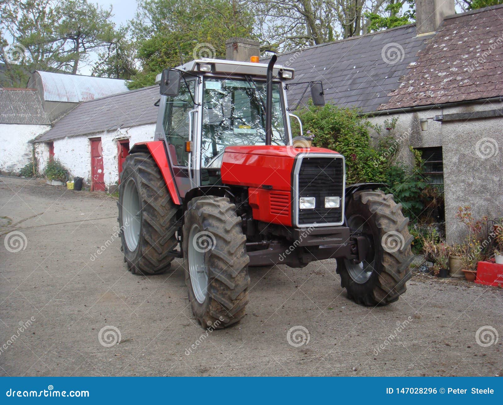 Red Tractor on Farmyard stock photo. Image of selfpropelled 147028296