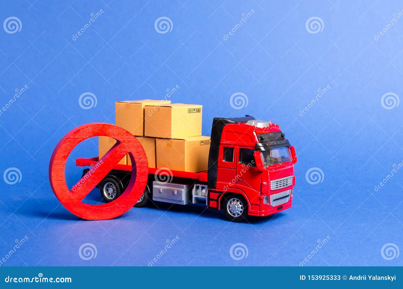 a red truck loaded with boxes and a red  no. embargo trade wars. restriction on importation, ban on export of dual-use goods