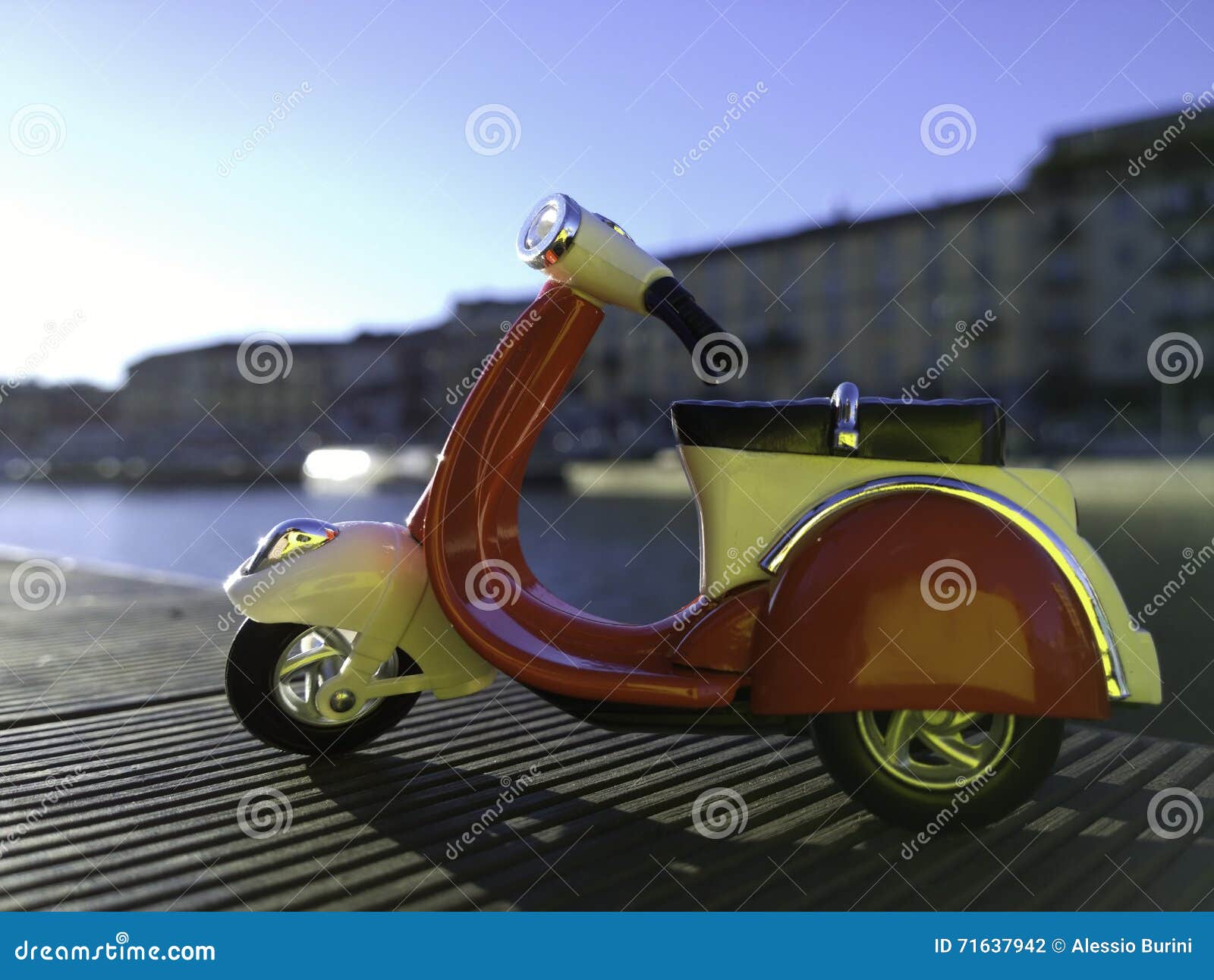 red vespa model parked on the side of darsena pier in milan italy