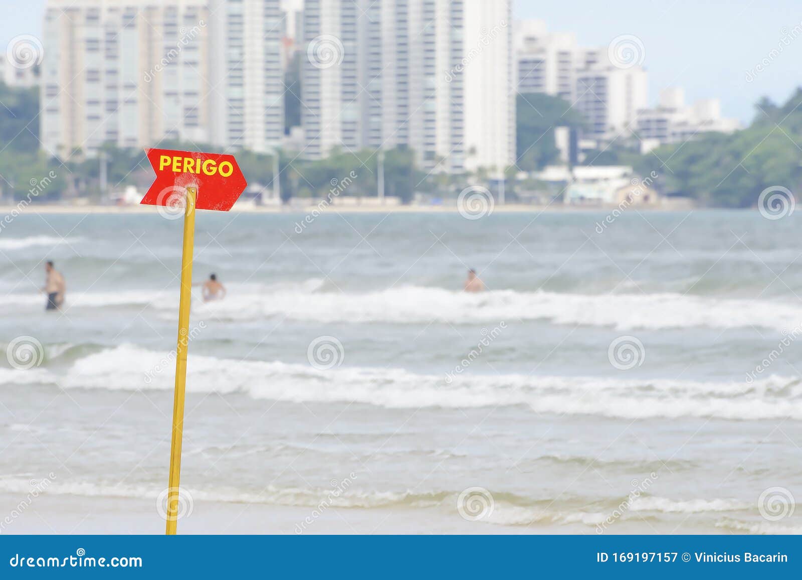 red warning sign at the beach