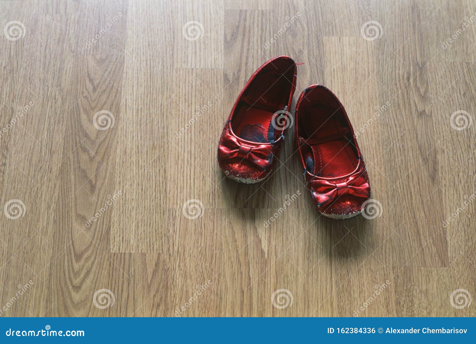 Red Well-worn Baby Girl Shoes on Wooden Background Stock Photo - Image ...