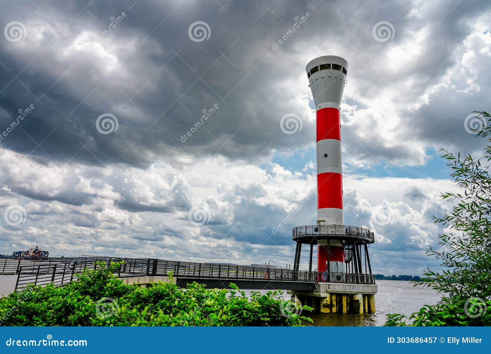 red and white blankenese lighthouse near hamburg. historic lighthouse on the elbe
