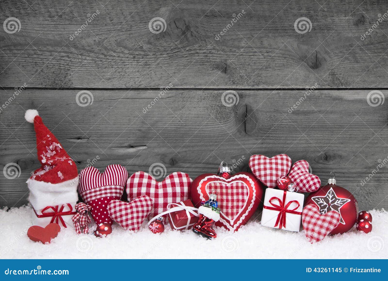 red white checked christmas decoration on grey wooden background