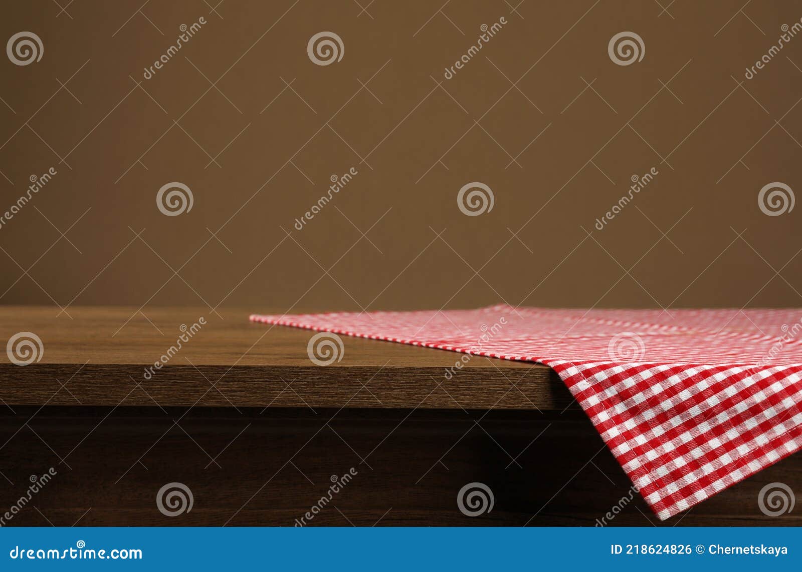 Red and White Checkered Tablecloth on Wooden Desk, Space for Design