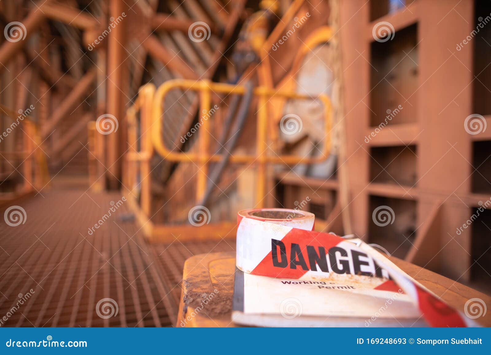 red and white exclusion dropped zone danger tape tags placing top of working at height permit book