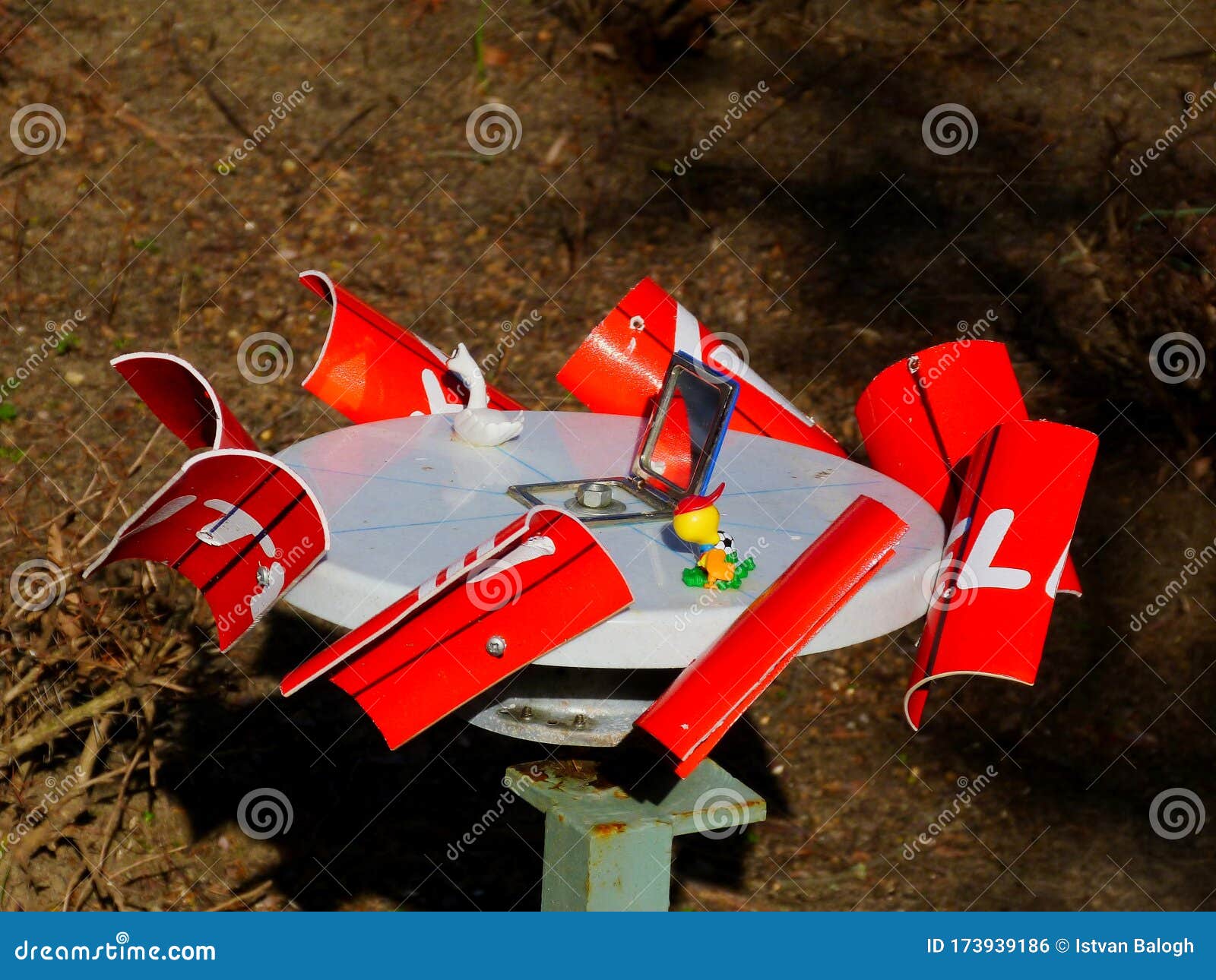 red and white hand made mobile spinning abstract device