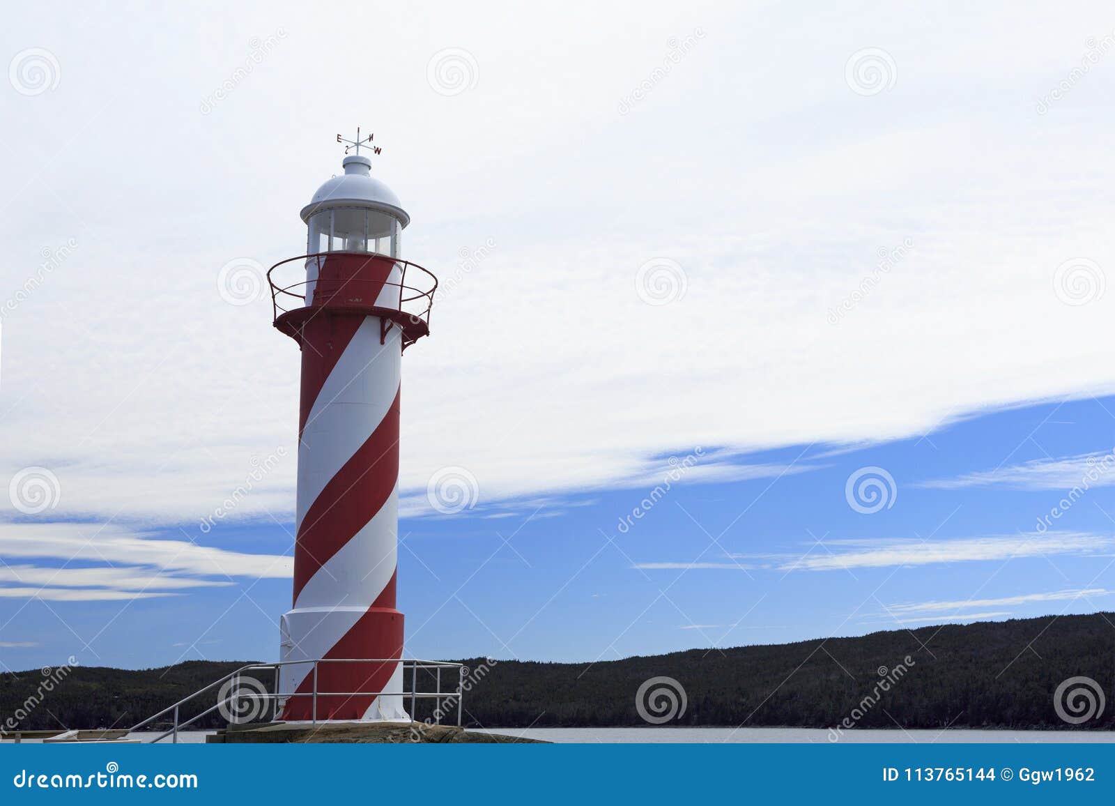 Red and white light tower stock photo. Image of landscape 113765144