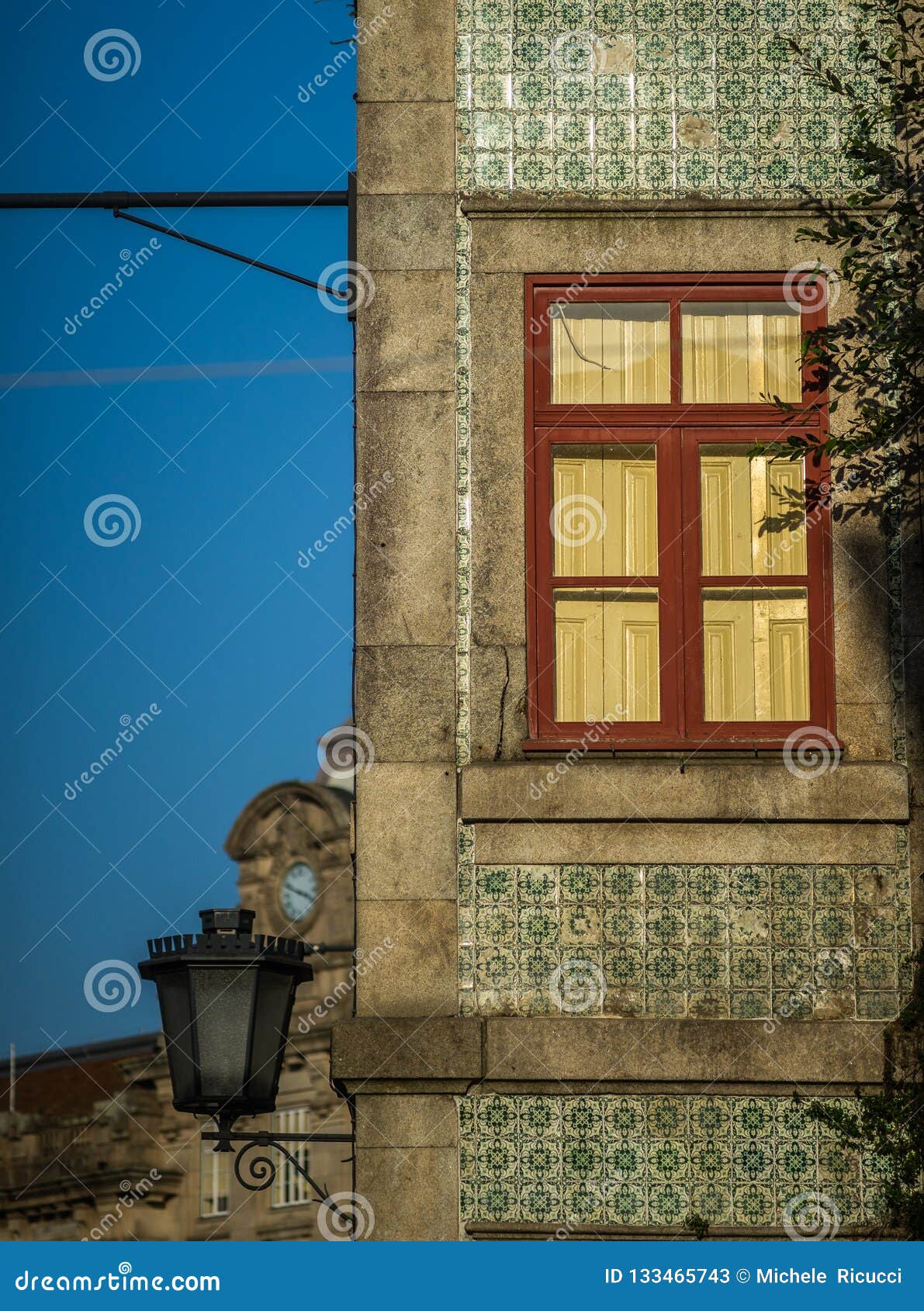 red window of ancien house with loantern