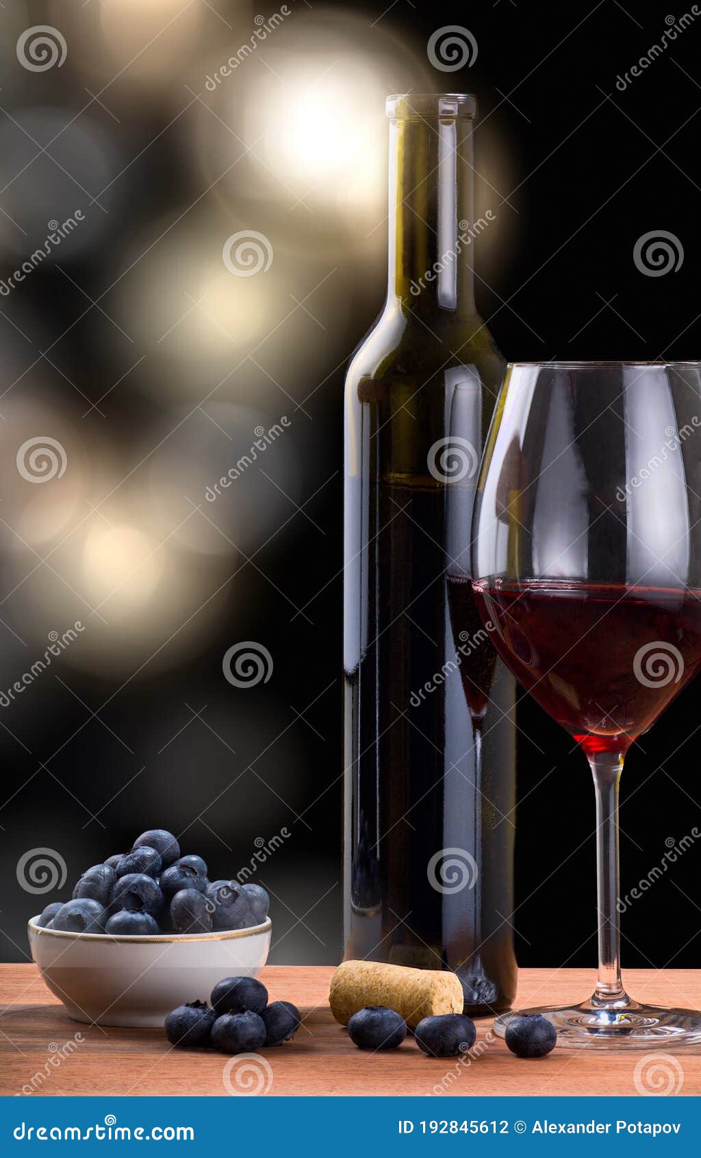 Red Wine and Blueberry Heap Isolated on Blured Background Stock Photo