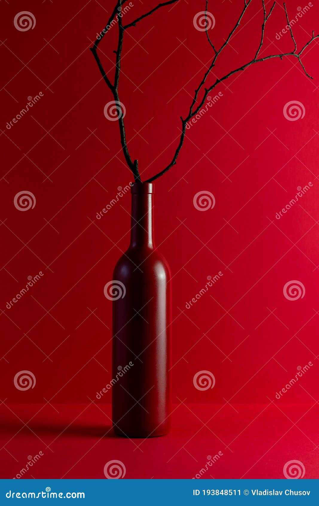 Red Wine Bottle and Tree Branch. Design. Creative Idea. Concept Stock