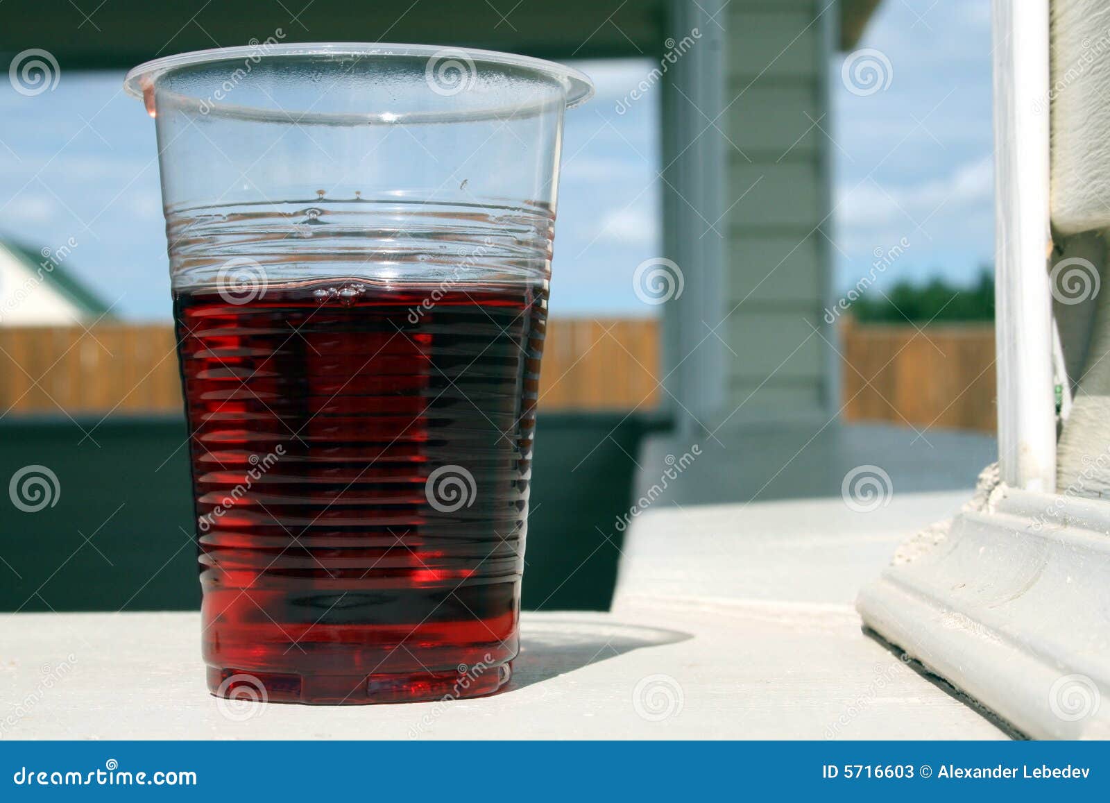 Red wine in plastic glass stock image. Image of surface 5716603