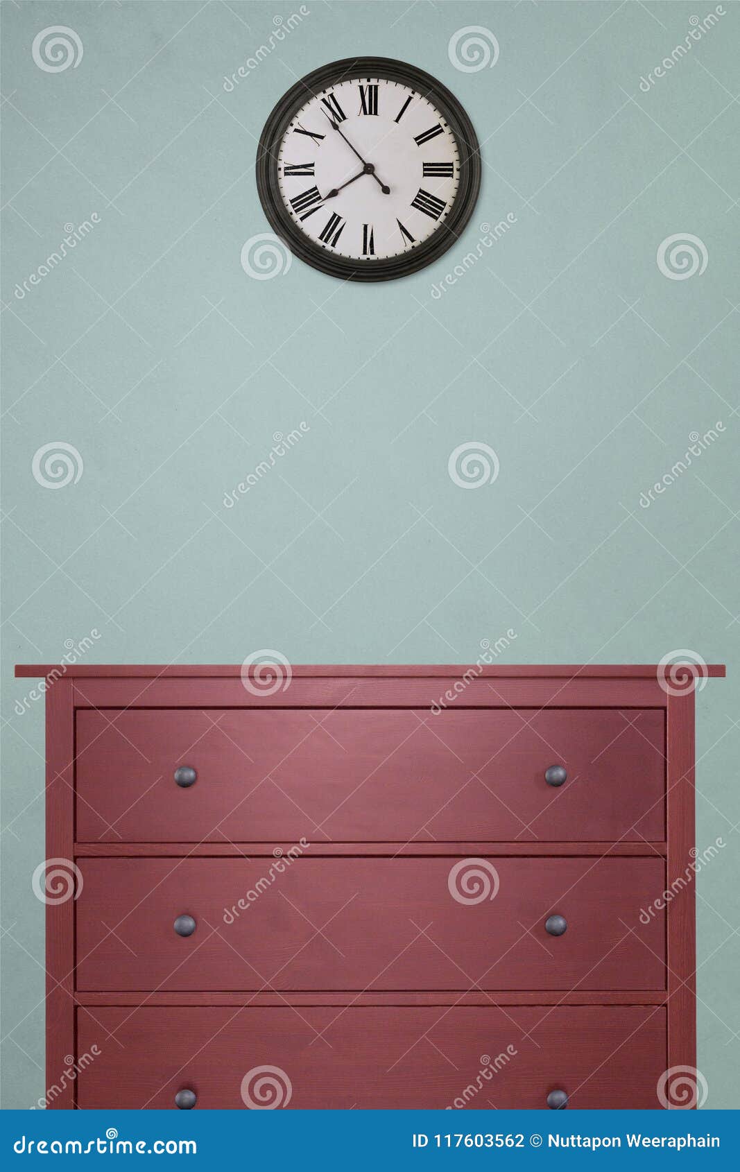 Red Wooden Cabinet And Clock In Empty Room With Pastel Green