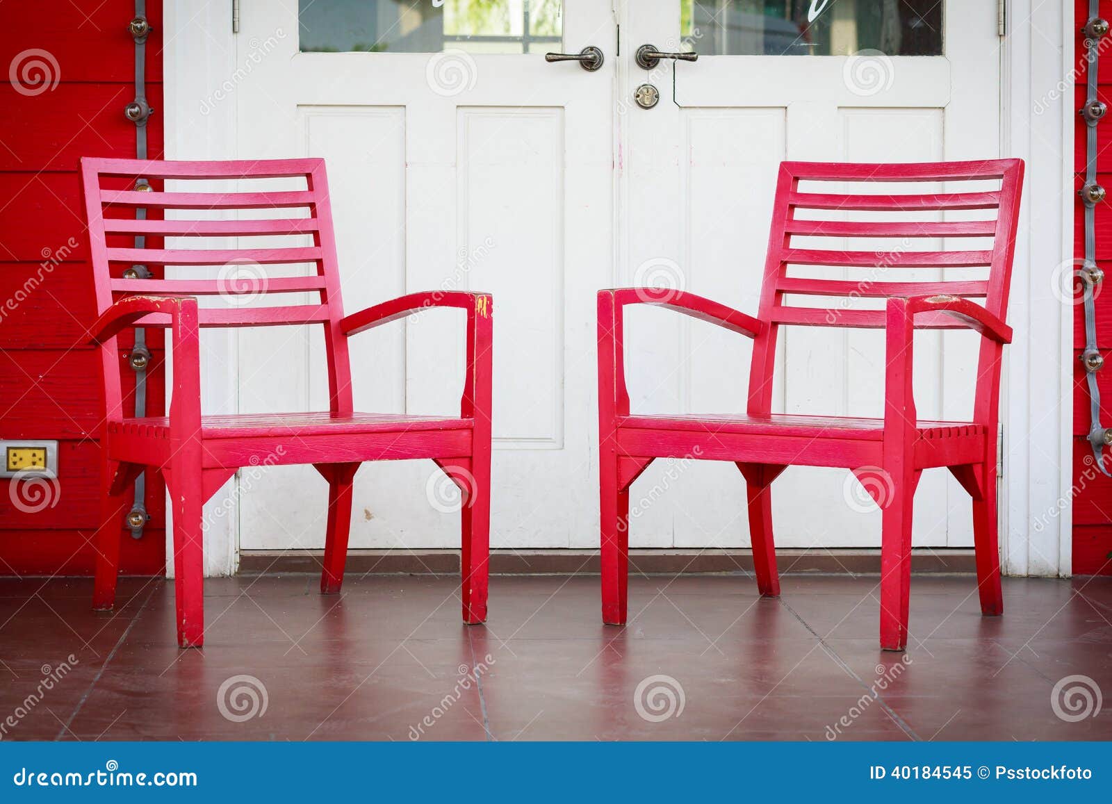 Red wooden Chair vintage style in front of white door