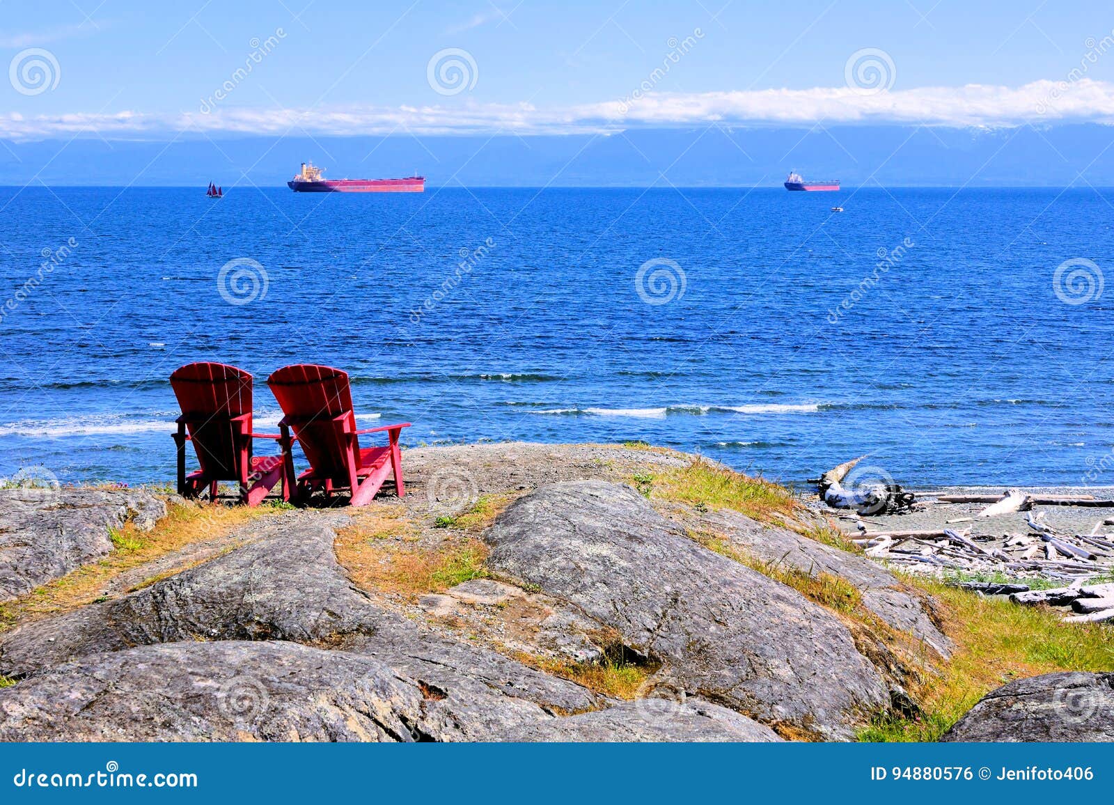 Red Wooden Chairs Overlooking The Ocean Stock Photo 