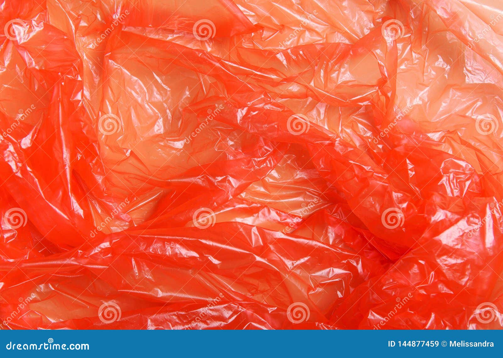 Red Wrap, Package Polypropylene, Plastic Packaging on a Beige