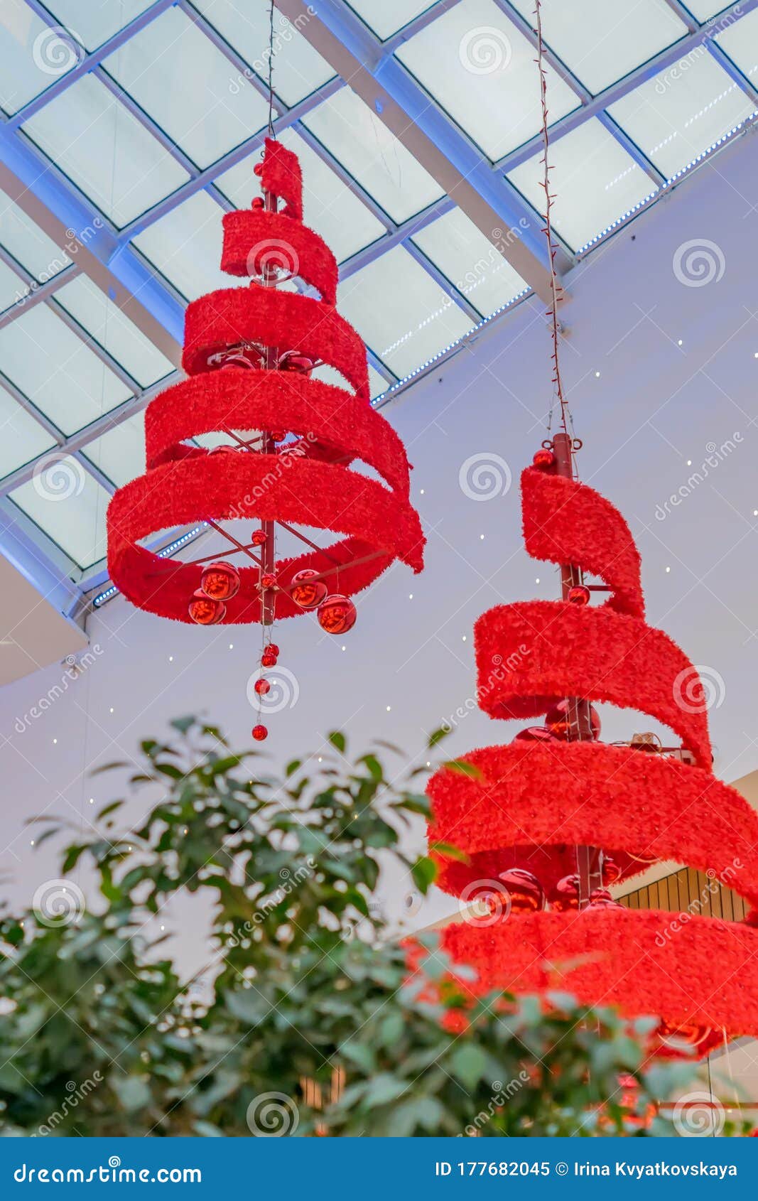 Red Xmas Tree and Garland Hanging on Ceiling Closeup Stock Image