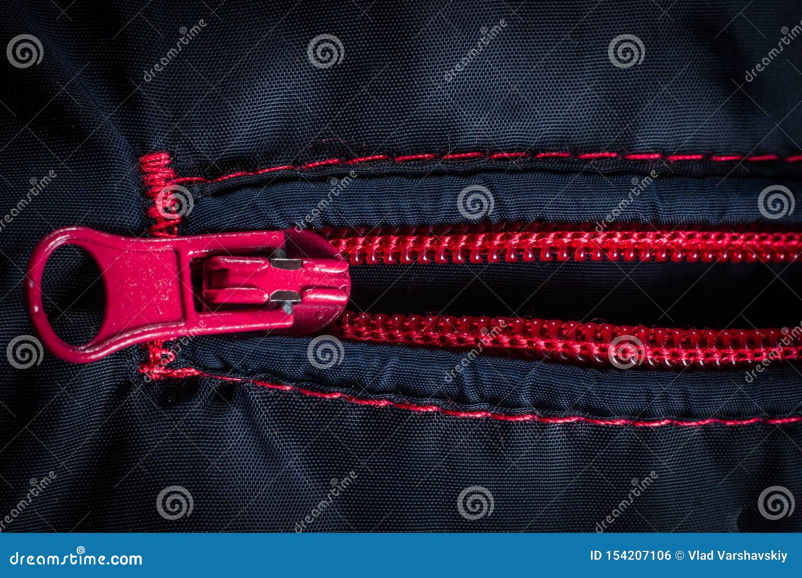 Red Zipper Clasp with Lock on the Bag Blue, Close-up Stock Photo ...
