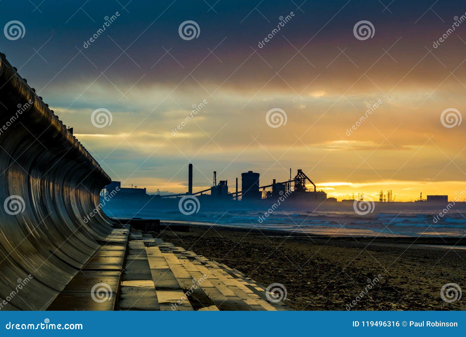 redcar beach at sunset. industrial background.