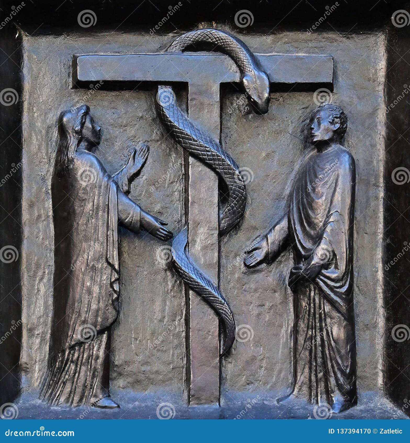 the redemptive death of christ depicted in the emblem of the bronze serpent, door of the grossmunster church in zurich