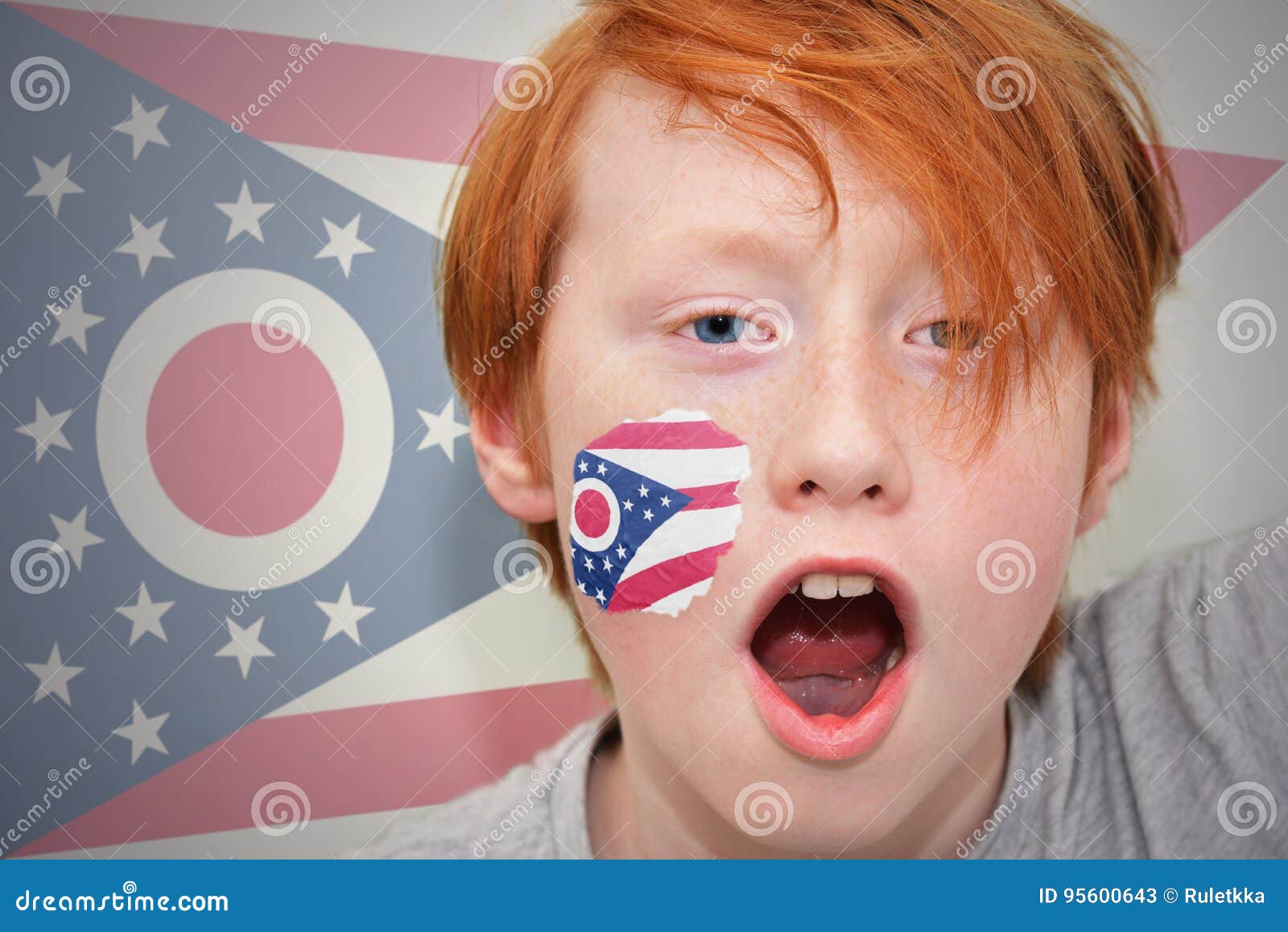 Redhead Fan Boy with Ohio State Flag Painted on His Face. Stock Image