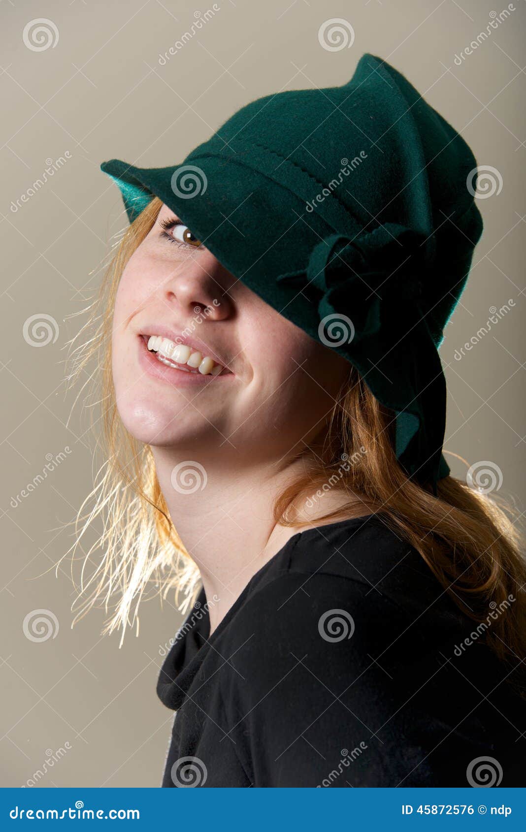 Redhead in Green Hat with Head Tilted Stock Photo - Image of black ...