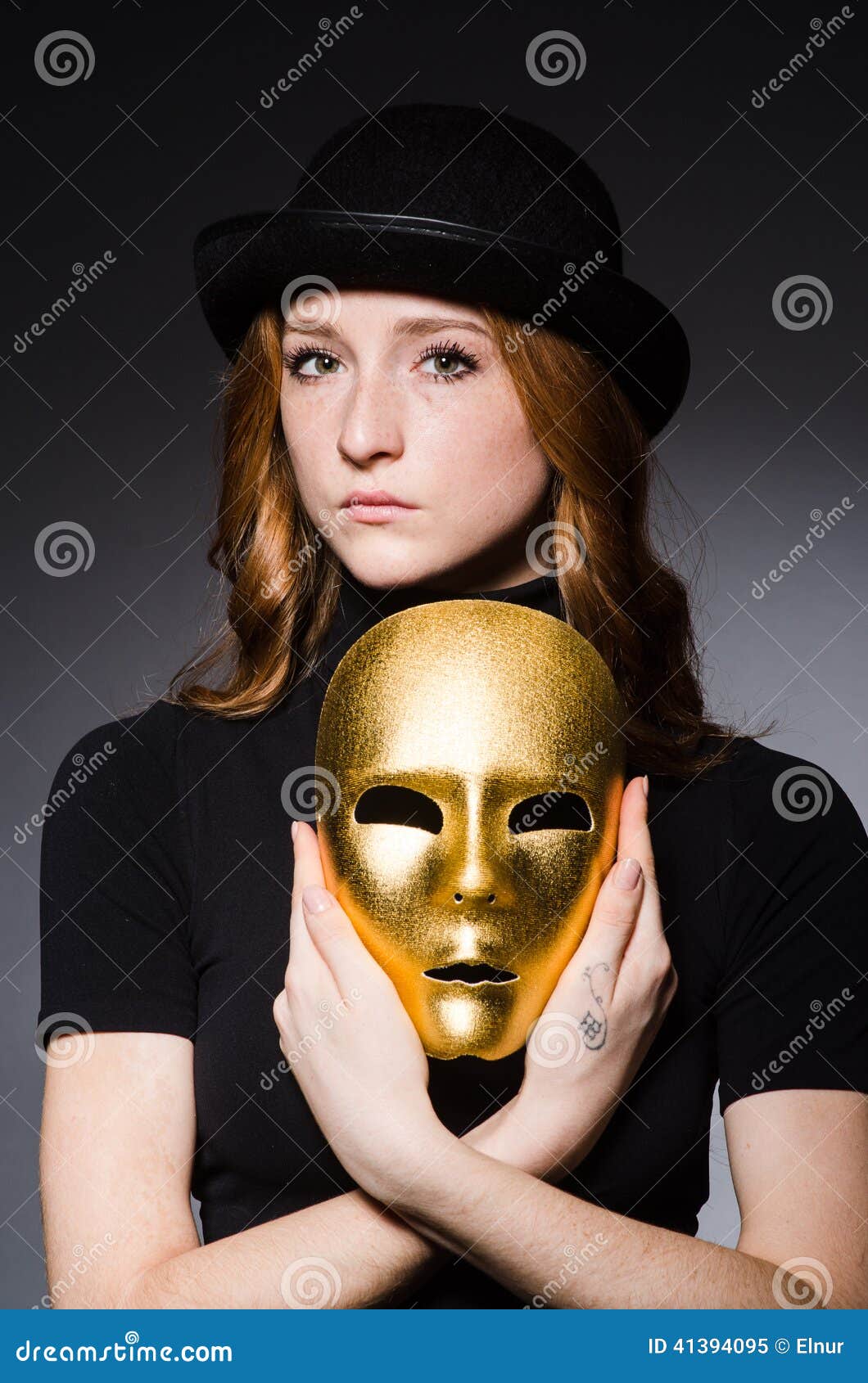 redhead woman in hat iwith mask in hypocrisy consept