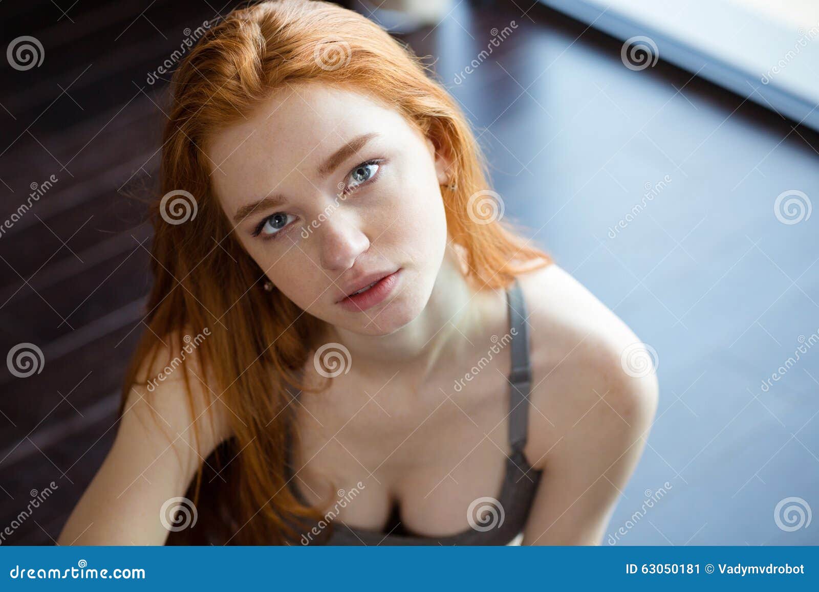 redhead woman sitting on the floor