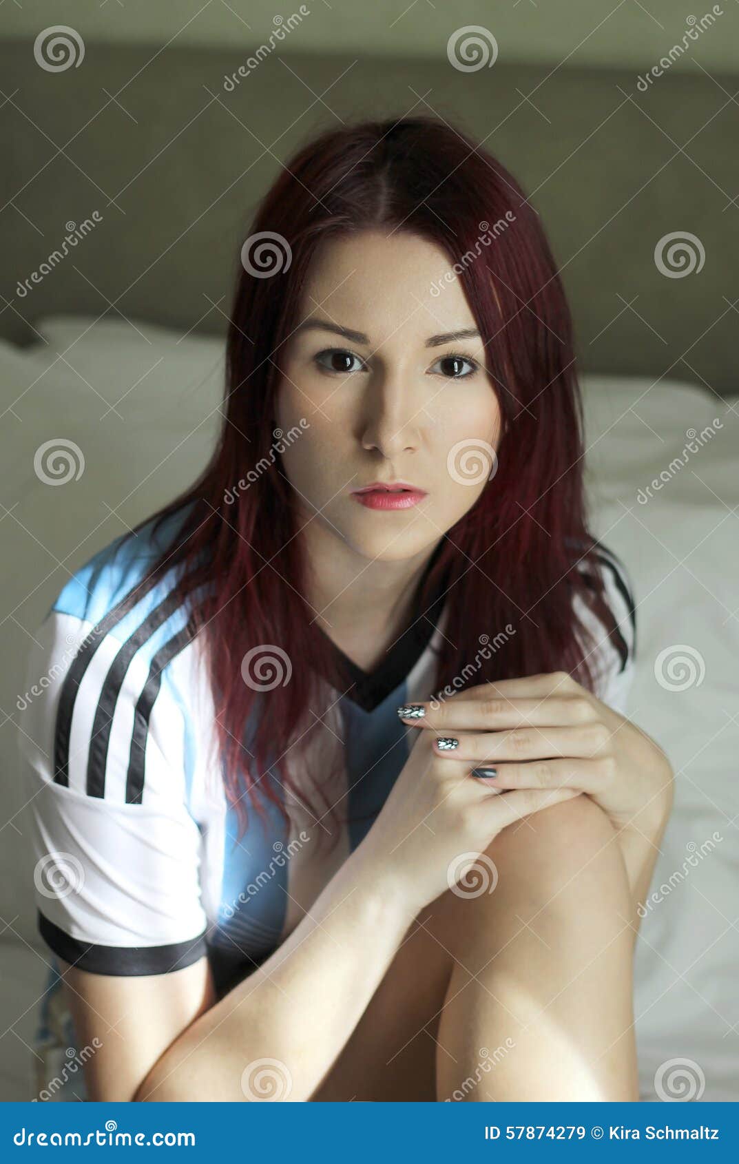 the redhead young woman in argentinean socker trikot portrait