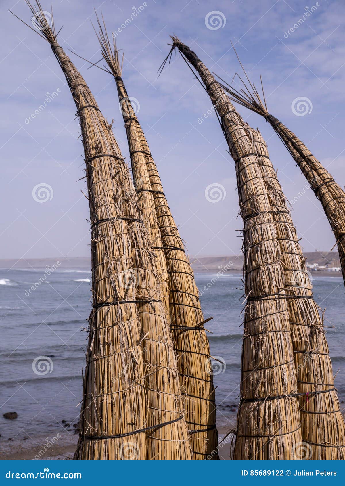 reed canoes on huanchaco beach, peru