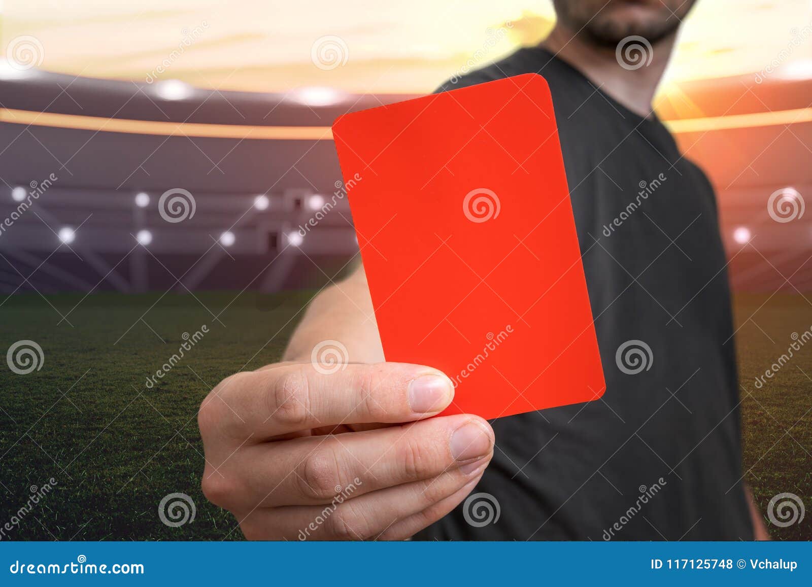 referee is showing red card as a penalty for a foul in soccer stadium