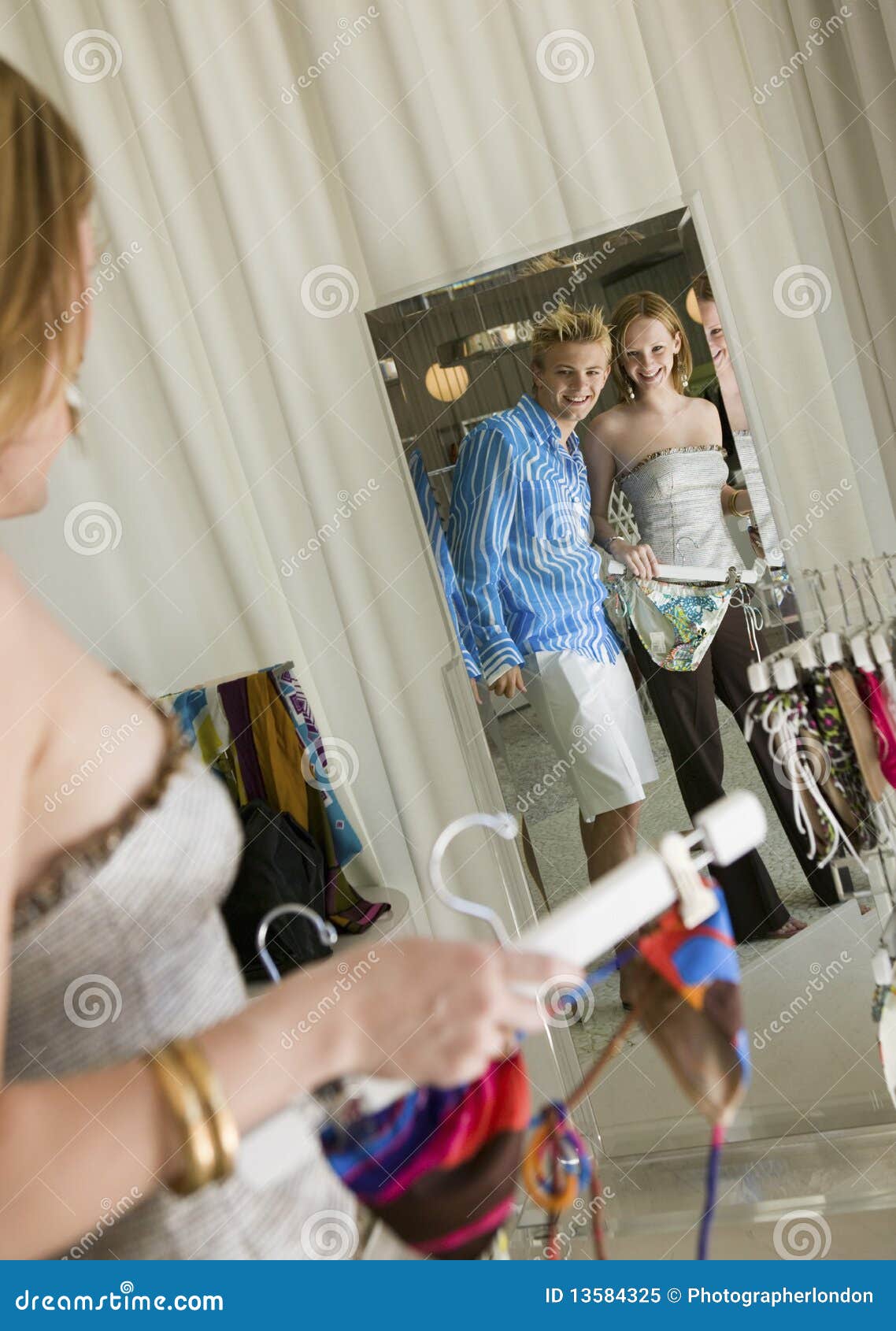 Reflection of Couple Looking at Mirror in Store Stock Image Image of clothing, clothes 13584325