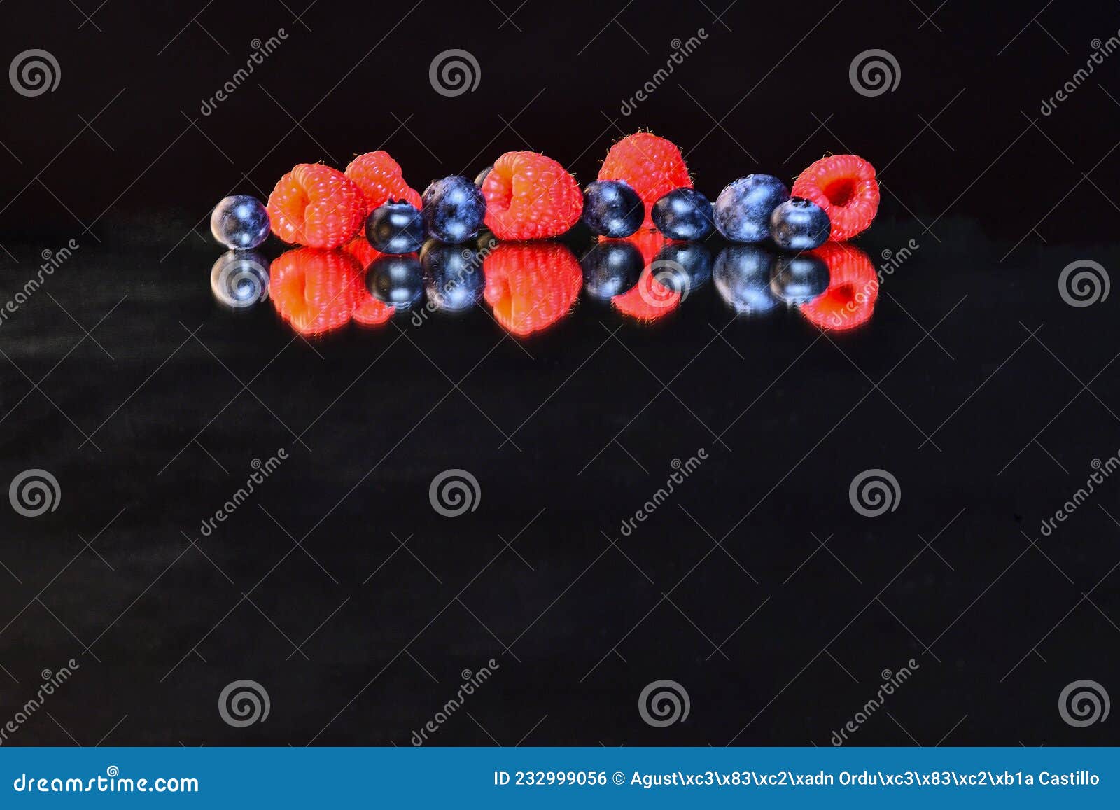 reflection of fruits, in a mirror on a black background