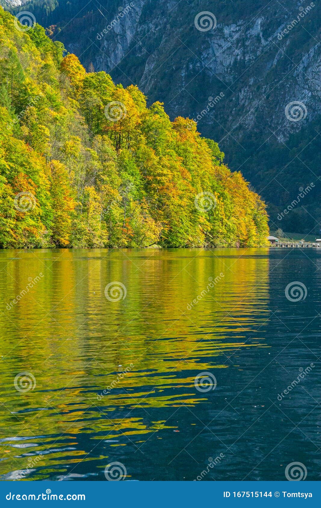 reflection of hills in koenigsee, autumn time in bavaria