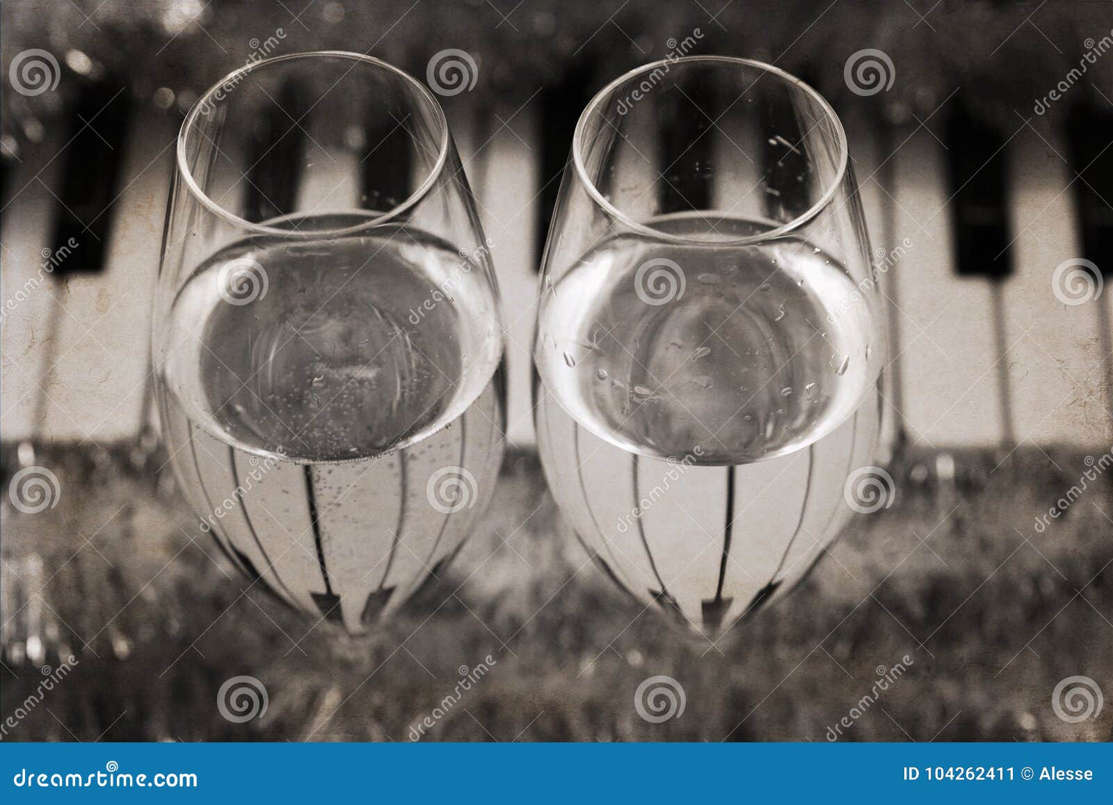 reflection of piano keys in two wine glasses, pianoforte